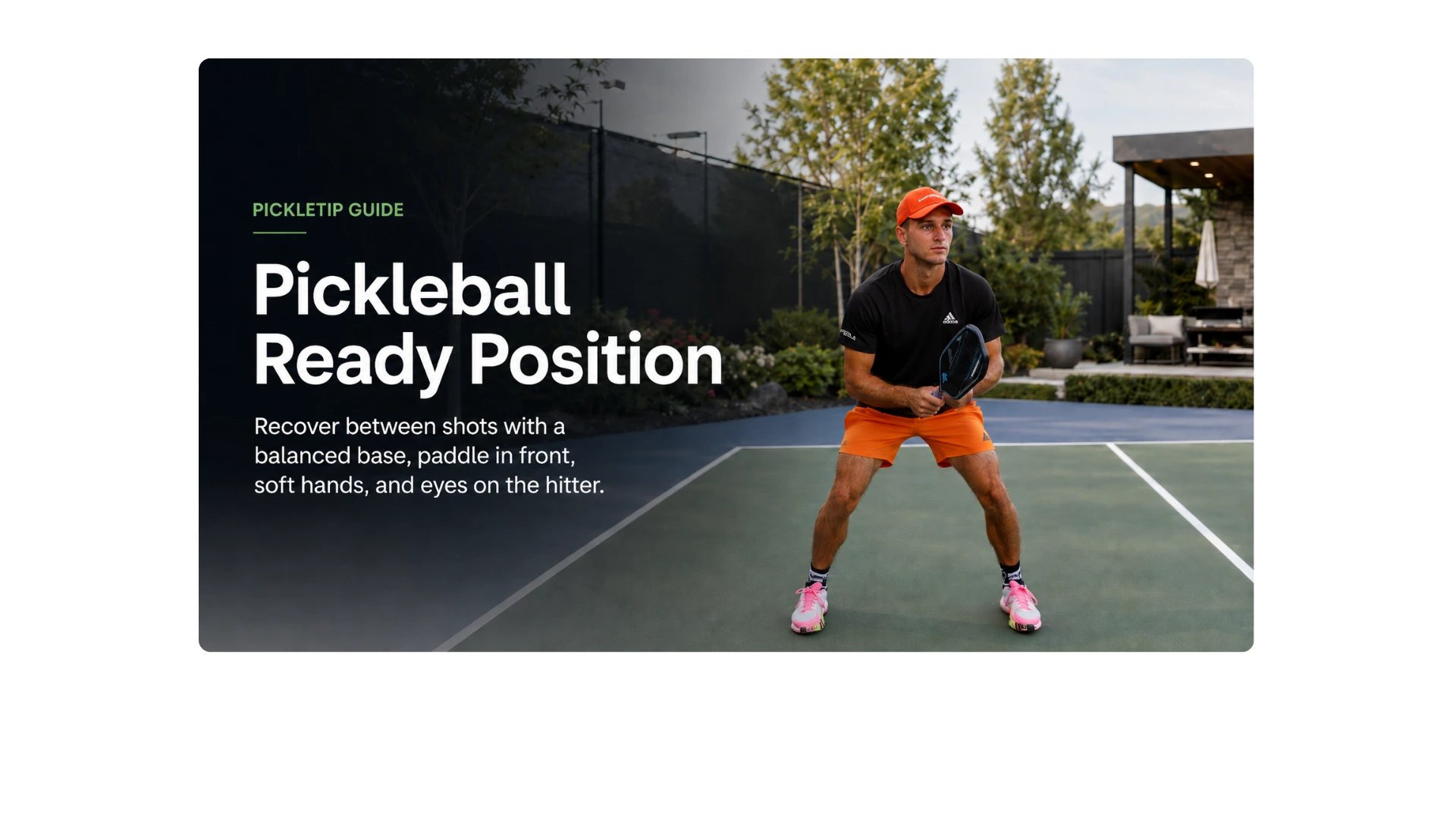 Coach AJ demonstrating a balanced pickleball ready position with the paddle held in front