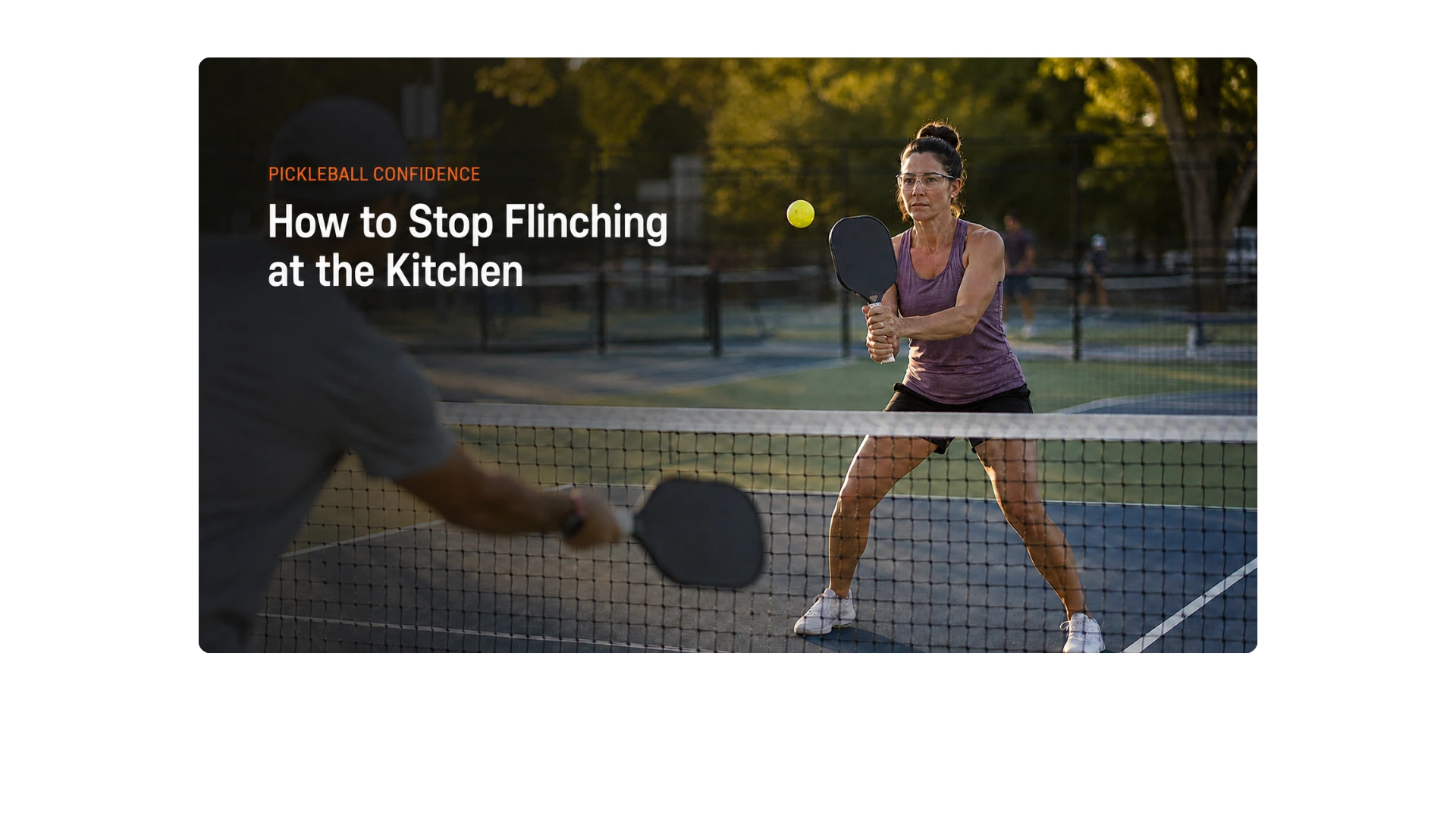 Woman wearing protective eyewear blocks an incoming pickleball at the kitchen line during a controlled drill.