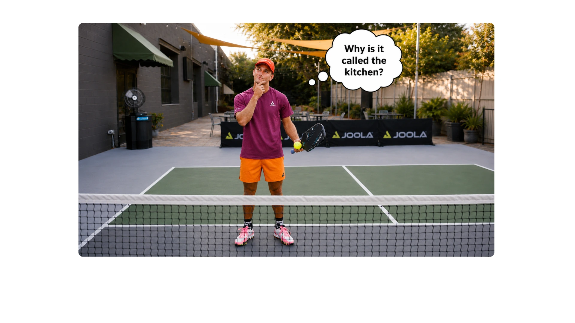 Coach AJ standing in the pickleball kitchen and wondering why it is called the kitchen