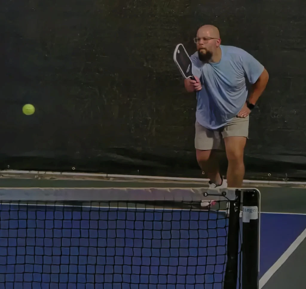Dale finishing a return of serve from the baseline while testing the Cyclotron Maks 001 paddle