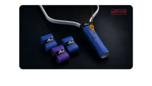 VYCE Honey Grip blue pickleball overgrip with honey dripping on the paddle handle beside blue and purple grip rolls.