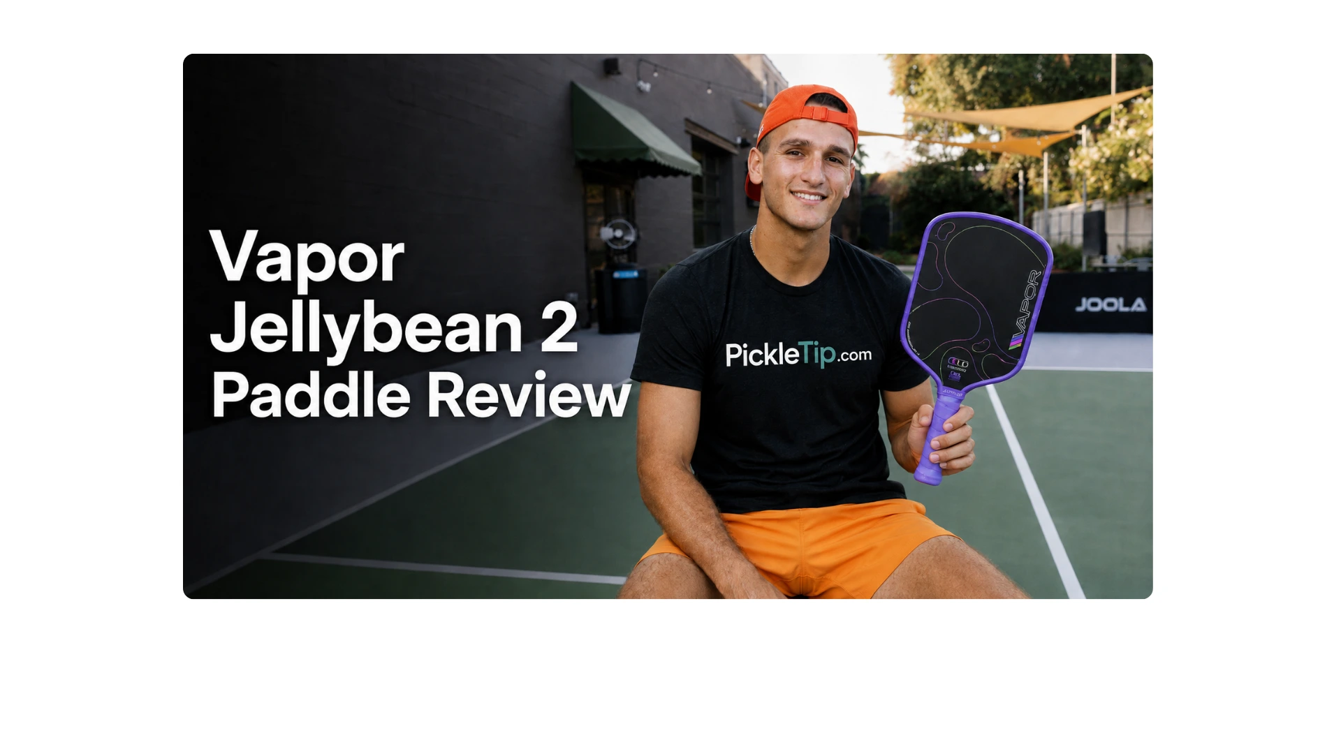 Coach AJ holding the 11SIX24 Vapor Jelly Bean 2 pickleball paddle